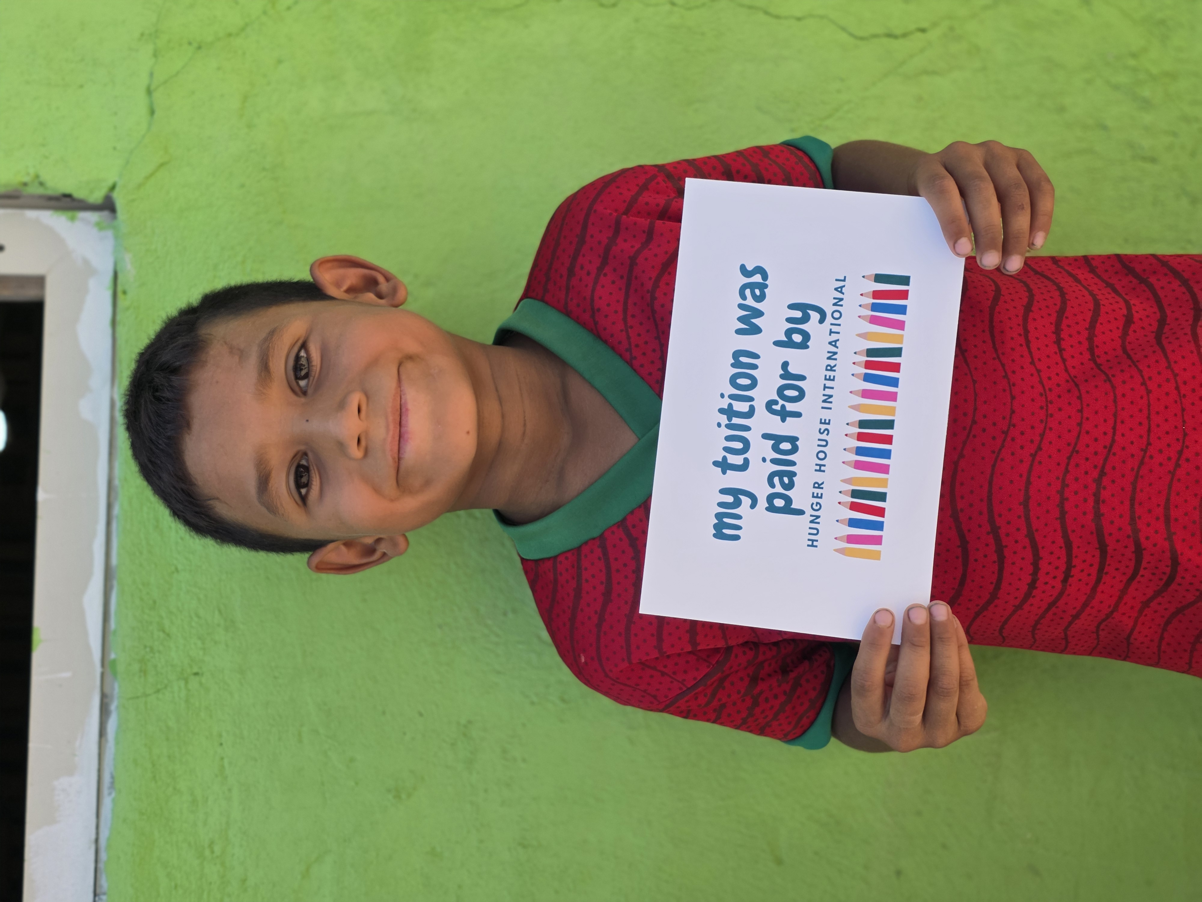 A child whose tuition was paid for by Hunger House